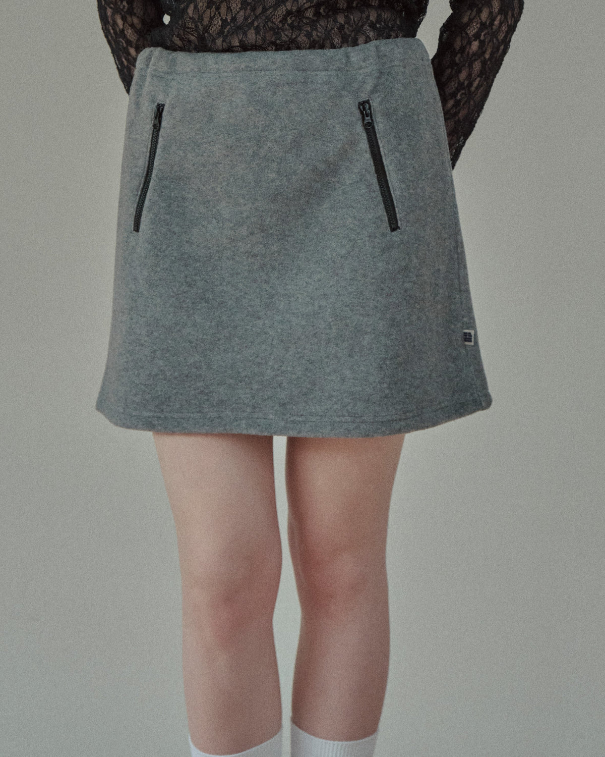FLEECE ZIP MINI SKIRT - BLACK